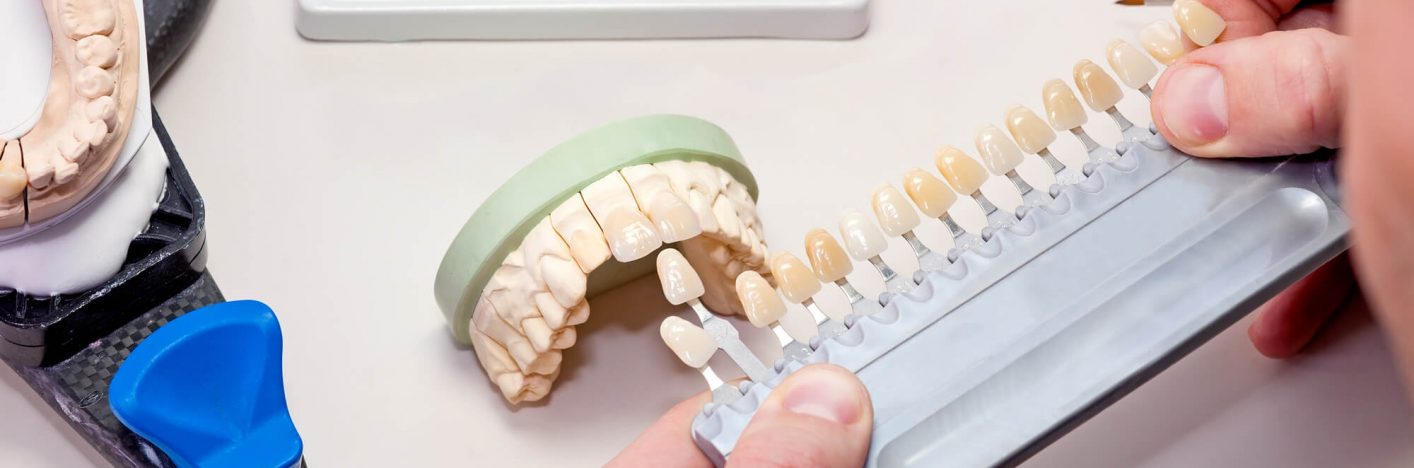 Artificial Teeth on White Table.