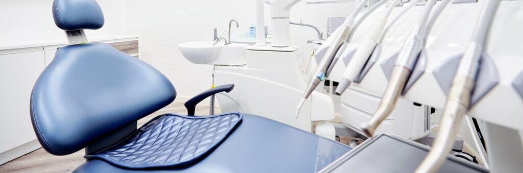 Dental chair with the dental equipment in the shot.